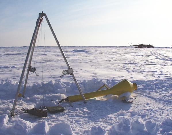 [Buoy deployment tripod, runway in background]